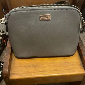 Michael Kors small dome crossbody taupe in color